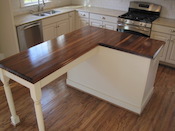 Walnut edge grain wood countertop, with sapwood and large double roman ogee edge. Waterlox finish. Plaza Midwood area in Charlotte, NC